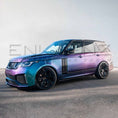 Load image into Gallery viewer, Front quarter angle toward the side of turquoise Range Rover Vogue with Barugzai Bison kit, showcasing arches and side skirts.