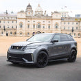 Load image into Gallery viewer, Range Rover Velar 2017 in Nardo Grey with Barugzai Huntress bodykit, front quarter angle, parked before a palace, fitted with Casanova wheels.