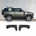 Load image into Gallery viewer, Side angle view of a matte green Land Rover Defender highlighting ENKAHNZ front left and right wings installed at the bottom of the vehicle for an upgraded, sporty look.