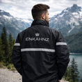Load image into Gallery viewer, Enkahnz Trademark Crown Jacket – Black in a nature background rear view.