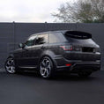 Load image into Gallery viewer, Rear quarter angle of Range Rover Sport 2018–2022 with Enkahnz LM style bodykit, displaying the distinctive rear bumper and contours.