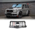 Load image into Gallery viewer, Gray Mercedes-Benz G-Wagon W464 G63 (2018-2022) Brabus-style front grille against a brick wall, featuring red and black modifications.