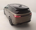 Load image into Gallery viewer, Rear Quarter view of a Range Rover Sport with an SV Style bodykit on a beige background.