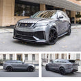 Load image into Gallery viewer, Silver Range Rover Velar, fitted with Barugzai Huntress bodykit, shown from different angles shot outside an old mill background. Fitted with Barugzai Opium 22" alloy wheels in Gloss Black