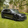 Load image into Gallery viewer, Black Range Rover L460 2022, fitted with Barugzai Nebula bodykit, shown front quarter angle, shot outside a histrorical landmark with greenery. Fitted with Barugzai Vortex Forged 24" alloy wheels in Gloss Black Polished