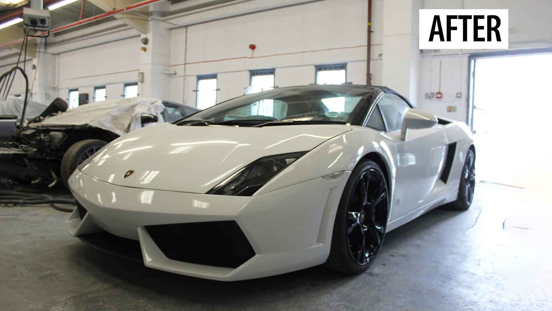 White Lamborghini Gallardo in Enkahnz workshop. After accident repair.
