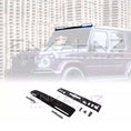 Load image into Gallery viewer, Front quarter view close up of a Purple Mercedes-Benz G-Class fitted with a Roof LED Light Bar in Gloss Black on a white background, kit reveal