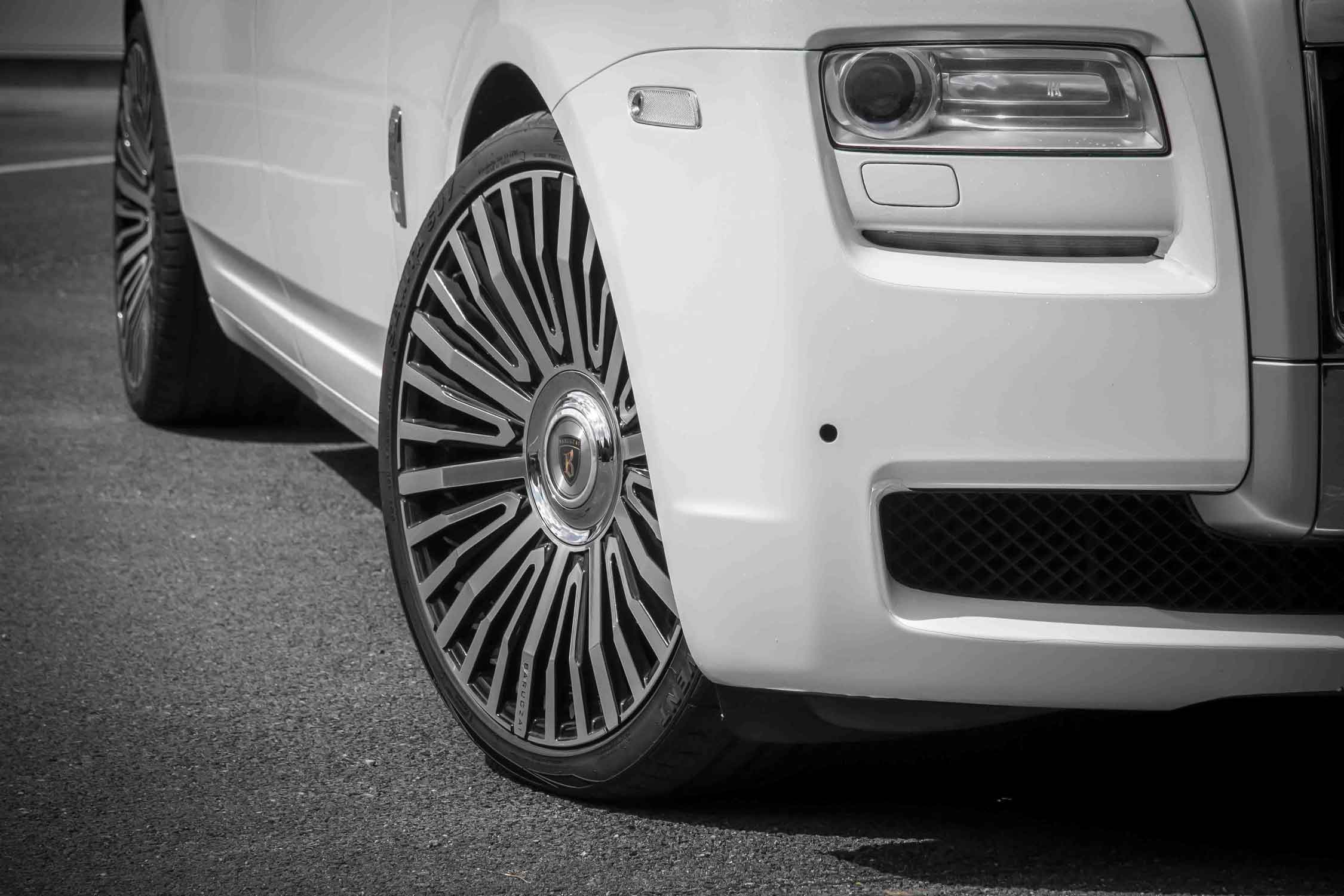 Close-up of a Rolls Royce Wraith, front wheel and grille. Fitted with Barugzai's Casanova 23