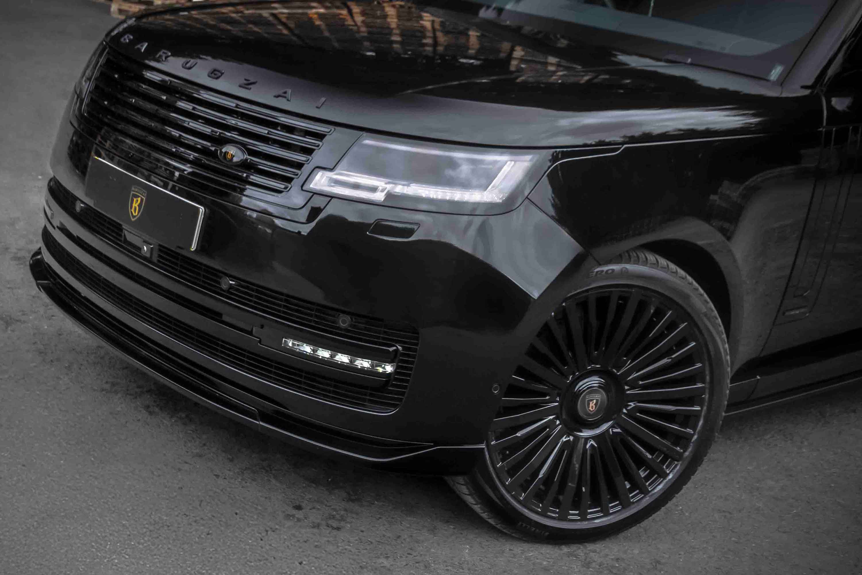 Black Range Rover L460, fitted with Barugzai Nebula soft bodykit with visible brand logo on a dark background. Fitted with Casanova alloy wheels 23