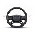 Load image into Gallery viewer, Alcantara heated steering wheel on a white background for Defender.
