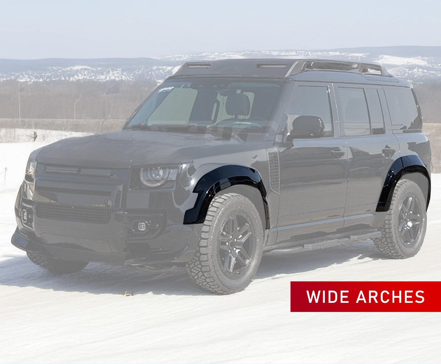 BARUGZAI WIDETRUCK WHEEL ARCHES GLOSS BLACK FOR DEFENDER 110 L663 2020 in an opaque white background of a winter setting. 