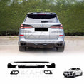 Load image into Gallery viewer, Rear angle of a BMW with ENKAHNZ LCI roof spoiler, rear bumper cover, and quad exhaust tips, emphasizing the bold bodykit upgrades.
