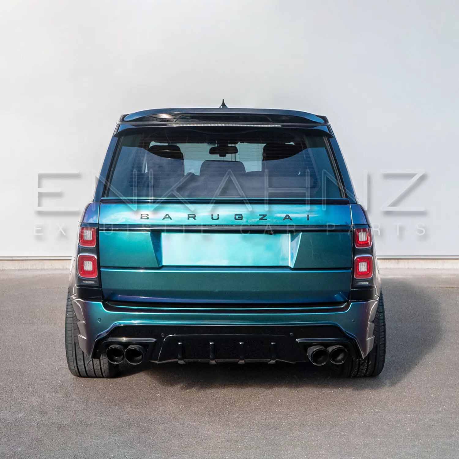 Rear angle of turquoise Range Rover Vogue with Barugzai Bison kit displaying bumper, diffuser and tailpipe surrounds.