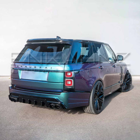 Rear quarter angle of turquoise Range Rover Vogue with Barugzai Bison bodykit emphasizing spoiler line and bumper contours.