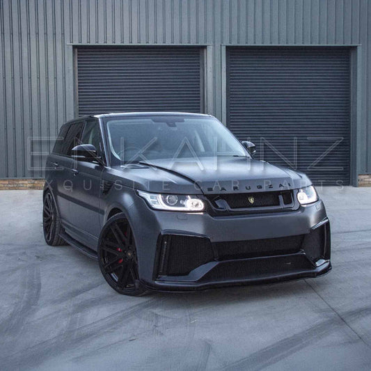 Matte grey Range Rover Sport (2013–2017) with Barugzai Cabaro bodykit, front quarter angle parked before warehouse shutters.