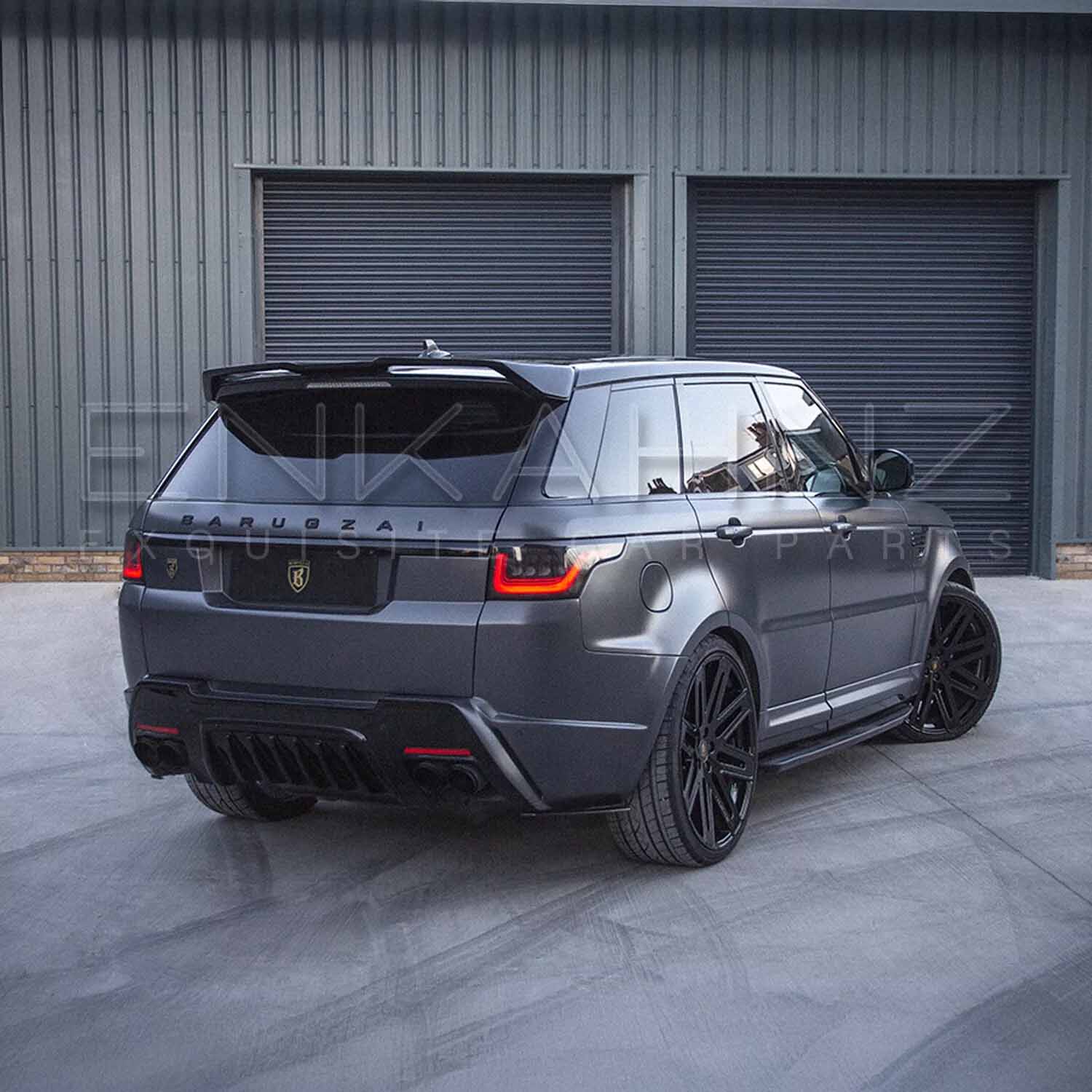 Rear quarter angle of Cabaro‑equipped Range Rover Sport, showcasing spoiler, bumper lines and stance.