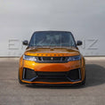 Load image into Gallery viewer, Front angle of orange Range Rover Sport Cabaro Wide Arch, highlighting bumper, grille, splitter and arch extensions.
