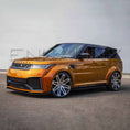 Load image into Gallery viewer, Front quarter angle from afar of orange Range Rover Sport Cabaro Wide Arch, capturing full silhouette and road presence.
