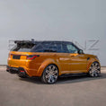 Load image into Gallery viewer, Rear quarter angle of orange Range Rover Sport Cabaro Wide Arch, detailing spoiler line, bumper contours and wide stance.
