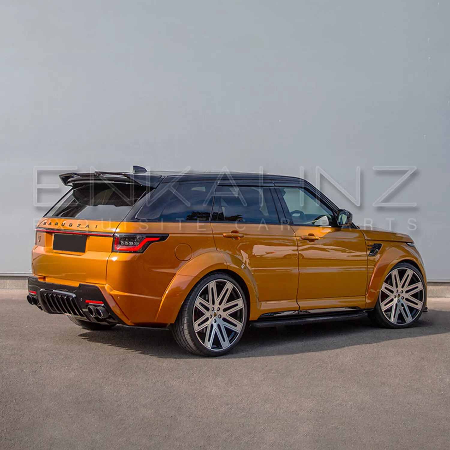 Rear quarter angle of orange Range Rover Sport Cabaro Wide Arch, detailing spoiler line, bumper contours and wide stance.