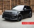Load image into Gallery viewer, Range Rover Vogue L460 2023+ in  black with Barugzai Nebula bodykit and Vortex wheels, front quarter angle with stacked wooden crates in the background.
