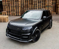 Load image into Gallery viewer, Front Top Quarter profile of Range Rover Vogue L460 2023+ in black featuring Barugzai Nebula bodykit and Vortex wheels on a clean backdrop.
