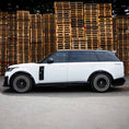 Load image into Gallery viewer, Side profile of Range Rover Vogue L460 2022+ in white and black featuring Barugzai Nebula bodykit and Vortex wheels on a clean backdrop.
