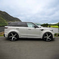Load image into Gallery viewer, Side profile of Range Rover Sport L461 with Barugzai Raptor bodykit beside a lake and misty green hills.
