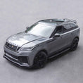 Load image into Gallery viewer, Top front quarter angle of Velar Huntress on road backdrop, highlighting grille, apron and Casanova wheel stance.
