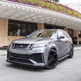 Load image into Gallery viewer, Front slightly lower quarter angle at five‑star hotel entrance, focusing on apron details and aggressive stance.
