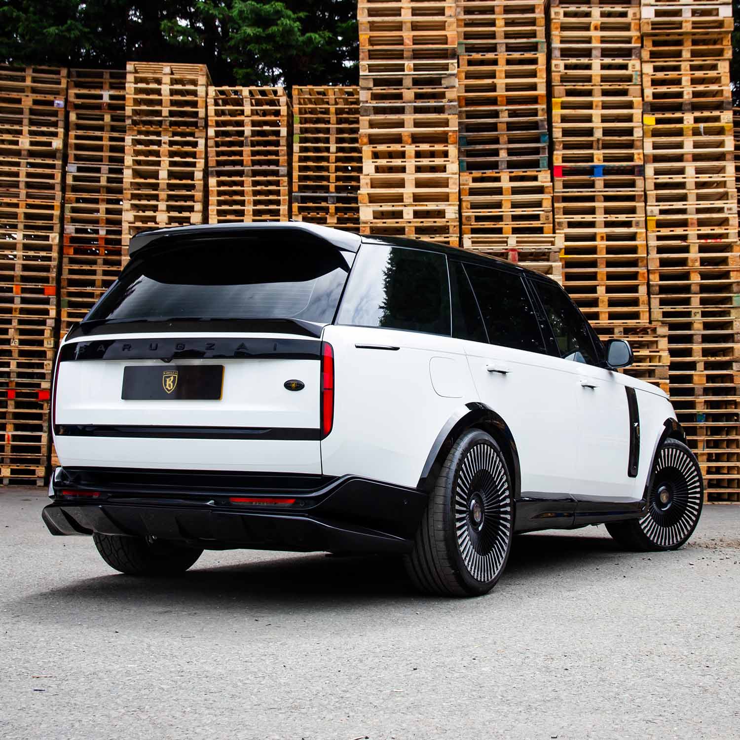 Rear quarter angle of Range Rover Vogue L460 2022+ with Barugzai Nebula bodykit, Vortex wheels, and contrasting black accents.