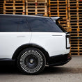 Load image into Gallery viewer, Side angle close‑up of rear section showing Barugzai Nebula side panels and Vortex wheel design on the Range Rover Vogue L460 2022+.
