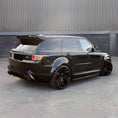 Load image into Gallery viewer, Rear quarter angle of a gloss black Range Rover Sport SVR 2018–2022, fitted with the Barugzai Cabaro Wide Arch bodykit by ENKAHNZ.

