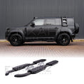 Load image into Gallery viewer, Black Defender Side ways with ENKAHNZ aftermarket side step part with product image at the bottom
