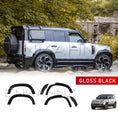 Load image into Gallery viewer, White Defender 110 with BARUGZAI Falcon bodykit on showcasing ENKAHNZ gloss black wheel arches from quarter back angle
