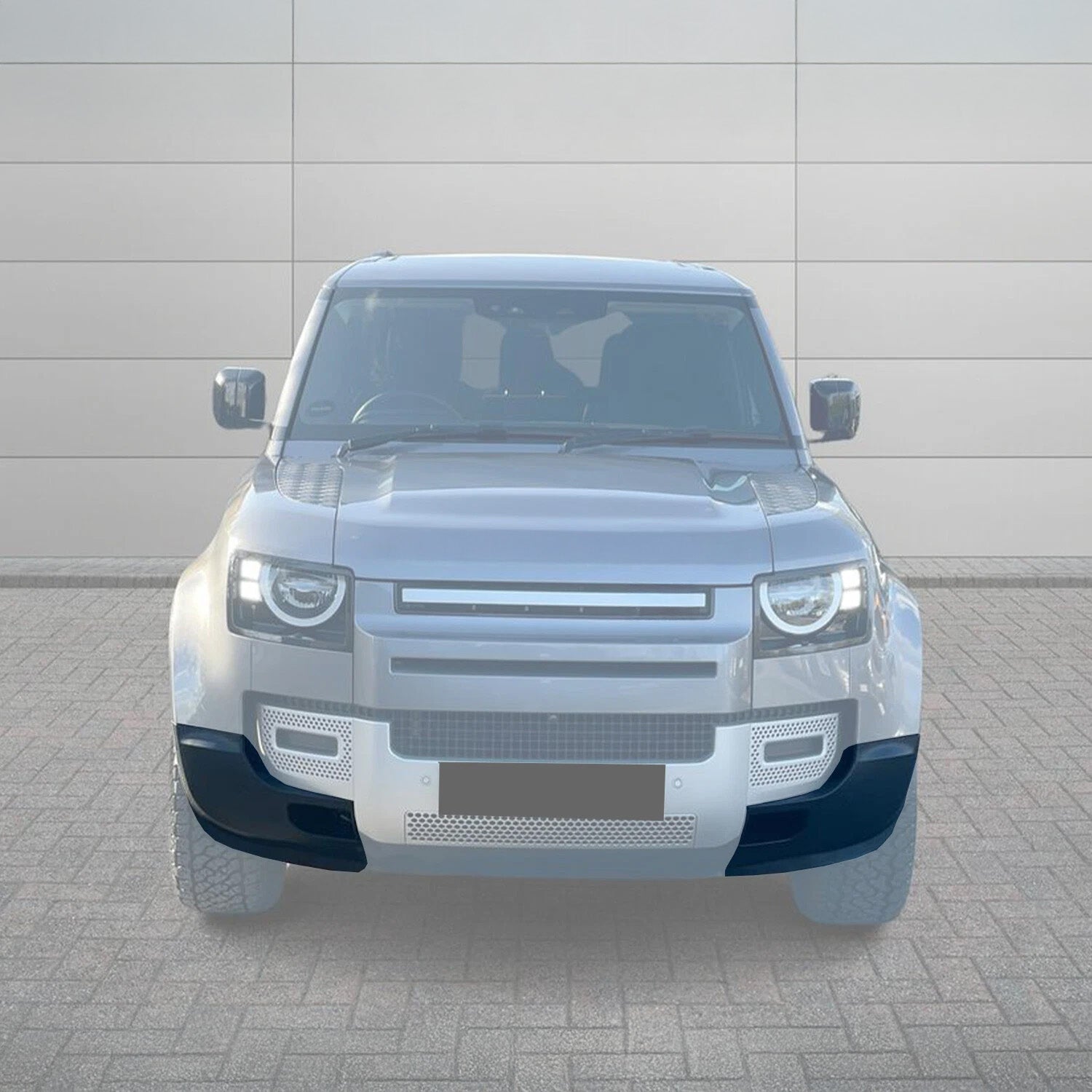 Front View of the Defender 110 fitted with ENKAHNZ bumper cover corner left and right highlighted