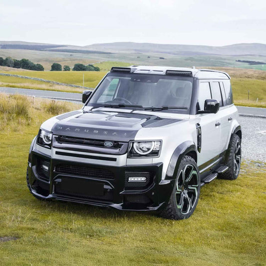 Front quarter shot up close, displaying the complete stance of the Defender 110 with the BARUGZAI Falcon kit, emphasizing its rugged, adventure-ready appeal.