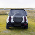 Load image into Gallery viewer, Rear view highlighting the BARUGZAI Falcon back bumper, roof spoiler, and stylish wheel cover on the Defender 110, demonstrating a distinctive and enhanced rear design.
