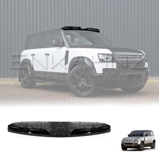 front-right angle of a white Defender, showing the LED light bar placement on the windshield’s top.