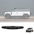 Load image into Gallery viewer, Side view from the right of a white Defender, focusing on the four-LED light bar highlighted above the windshield.
