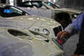 Load image into Gallery viewer, Sanding disc working on a car bonnet during surface preparation.
