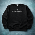 Load image into Gallery viewer, Enkahnz Trademark Crown Jumper – Black in a premium teal background. 
