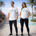 Load image into Gallery viewer, Enkahnz Trademark Crown T-Shirt – White in a resort background with a male and female showcasing the products.
