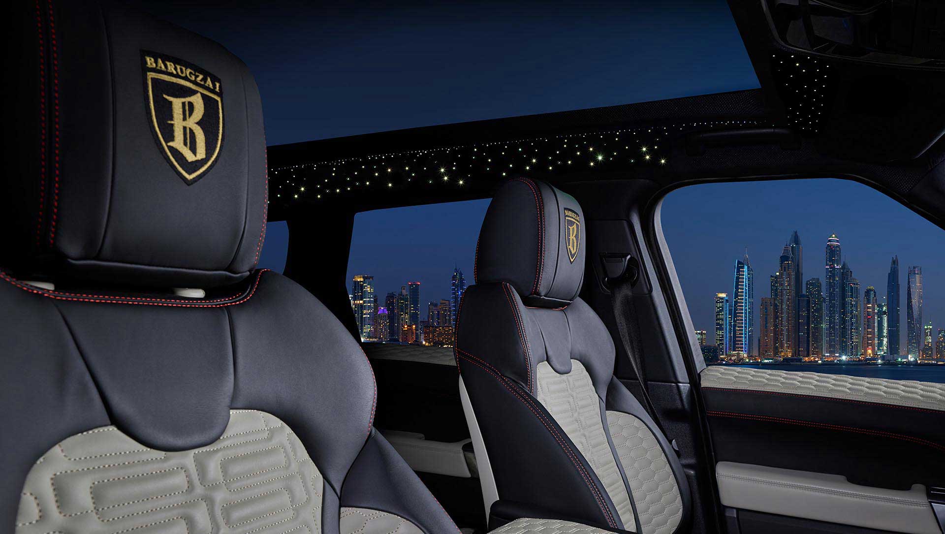 Range Rover Sport L494 Interior with branded headrests and a cityscape view at night. Barugzai Galaxy Roof Lining