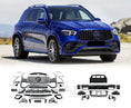 Load image into Gallery viewer, Blue Mercedes-Benz SUV with car body kits displayed below on a road with mountains in the background
