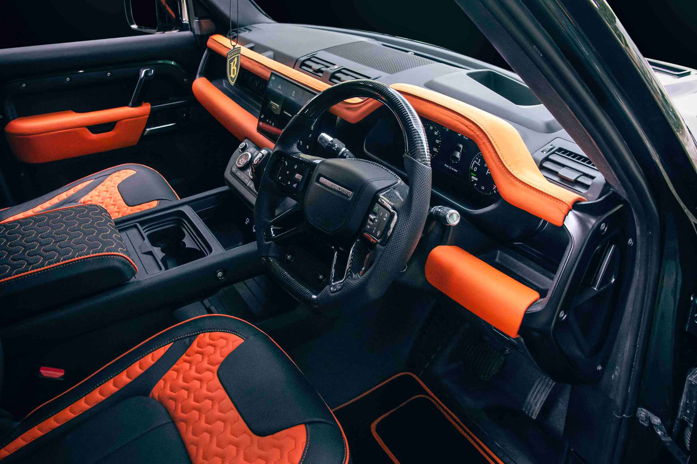 Land Rover Defender 110 L663, car interior with black and orange design