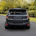 Load image into Gallery viewer, Rear side angle of Range Rover Sport 2013-2017 equipped with ENKAHNZ LM Style bodykit, displaying the redesigned rear bumper and distinct LM accents.
