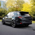 Load image into Gallery viewer, Rear quarter view of the jet black Range Rover Sport featuring the ENKAHNZ LM Style bodykit, highlighting the sleek aerodynamic enhancements and sporty rear profile.
