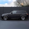 Load image into Gallery viewer, Side profile view of Range Rover Sport 2018–2022 equipped with Enkahnz LM style bodykit, showcasing sleek extensions and side skirts.
