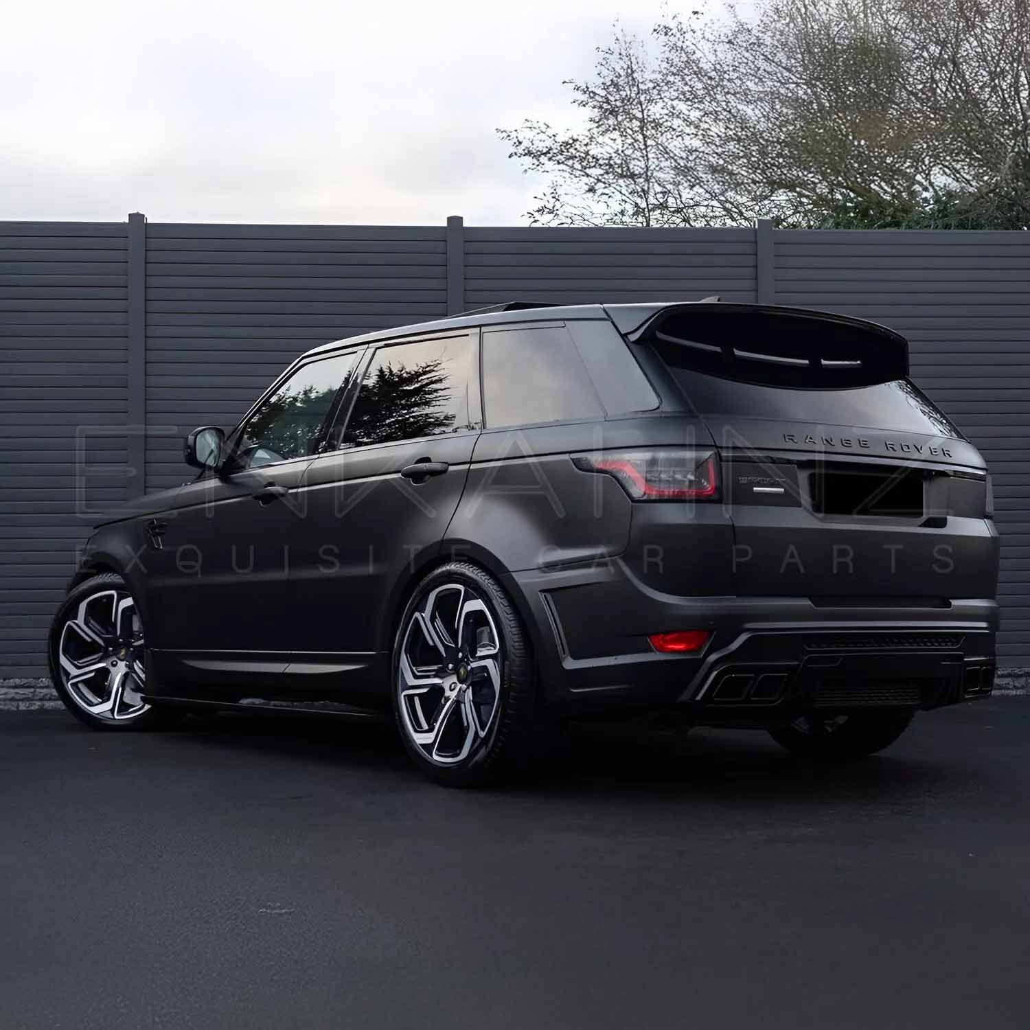 Rear quarter angle of Range Rover Sport 2018–2022 with Enkahnz LM style bodykit, displaying the distinctive rear bumper and contours.